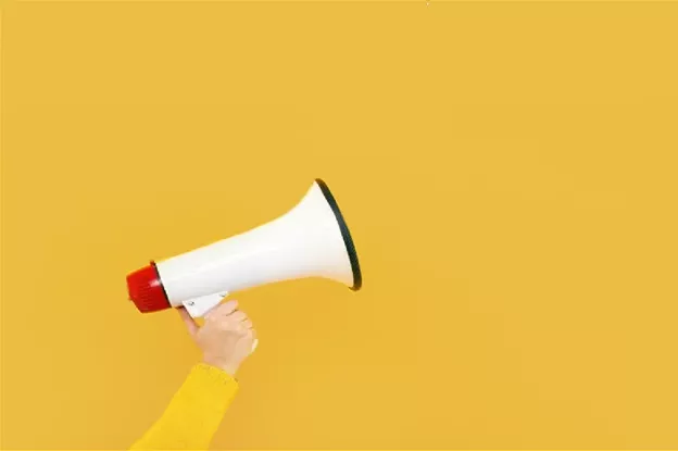 megaphone on yellow background